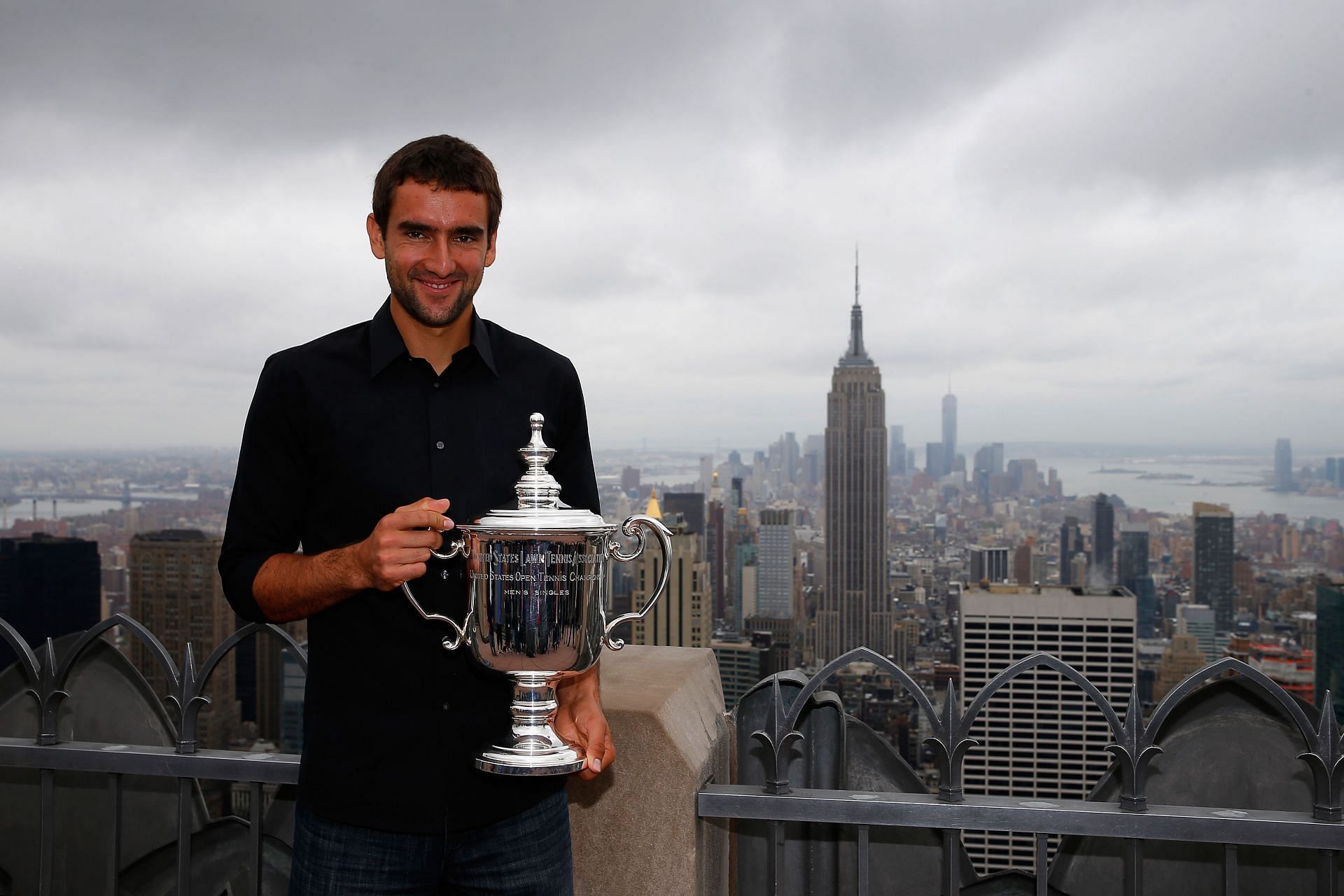 Cilic with the winner's trophy at the 2014 US Open - Source: Getty
